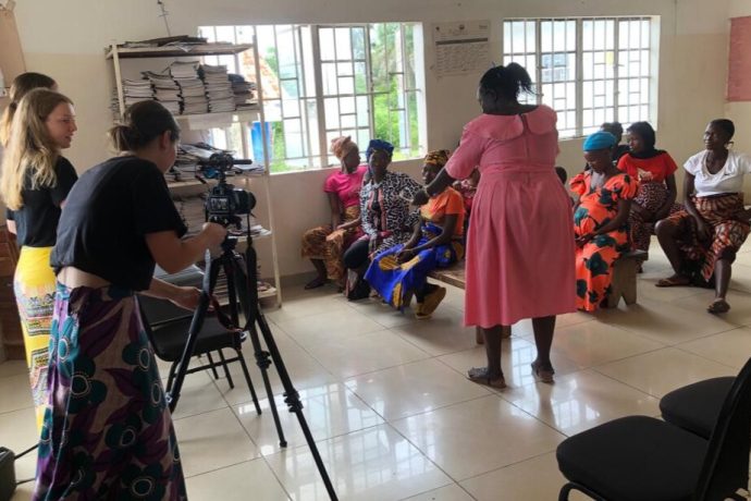 Image of students filming a conversation about healthcare in Sierra Leone.